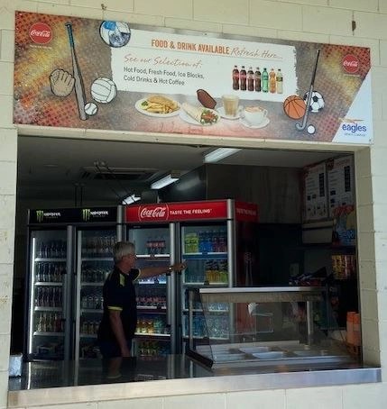 The on-site canteen kiosk at Eagles Sports Complex, stocked with drinks and hot food for players and spectators.